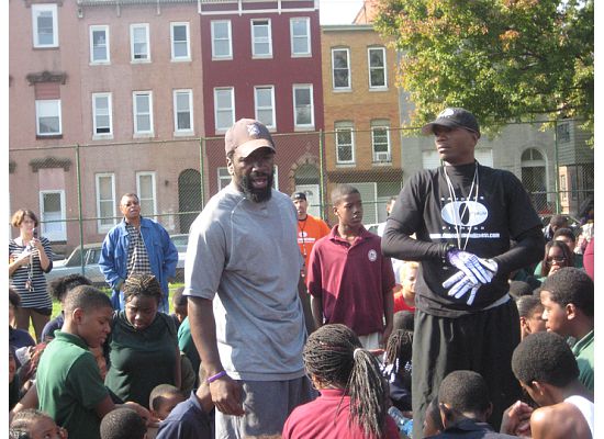 Reed and Sanders speaking to students at the Ed Reed Foundation’s Annual Youth Fitness Day